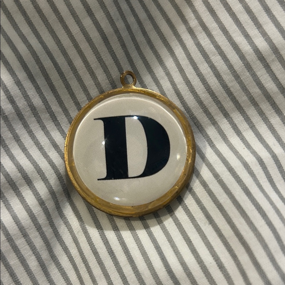 Dual Sided Black Letter D Small White Round Pendant W/Gold Trim